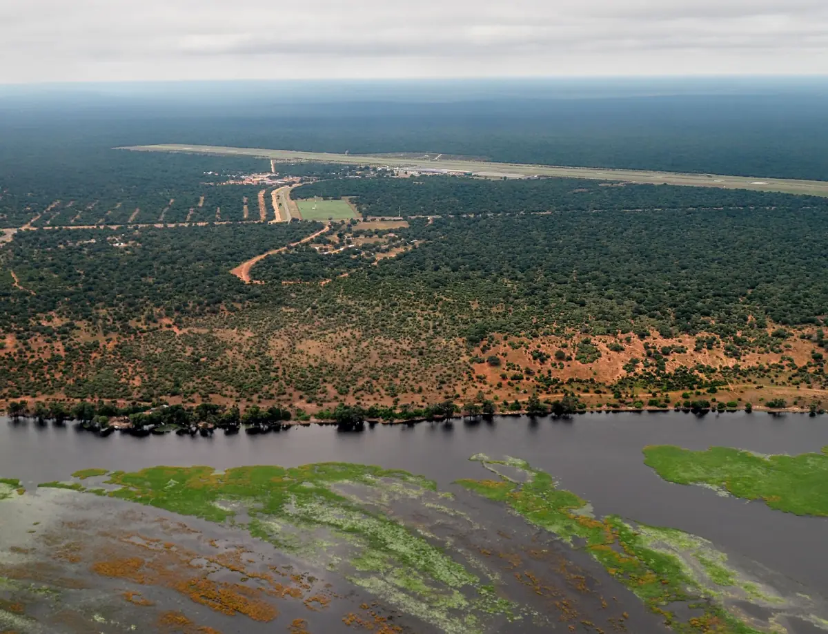 The runway of Kasane Airport seen from the air beside the Chobe River